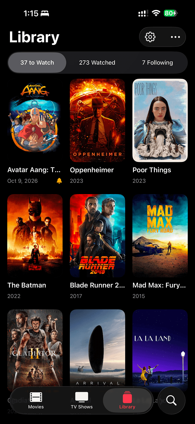 Cue’s Library screen showing a grid of saved movies and shows